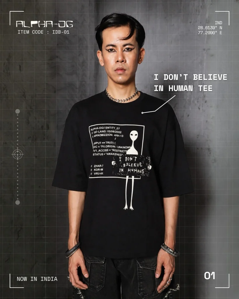 I Don't Believe in Humans" Tee — part of ALPHA OG's Entity series, built around the brand's alien-inspired design language